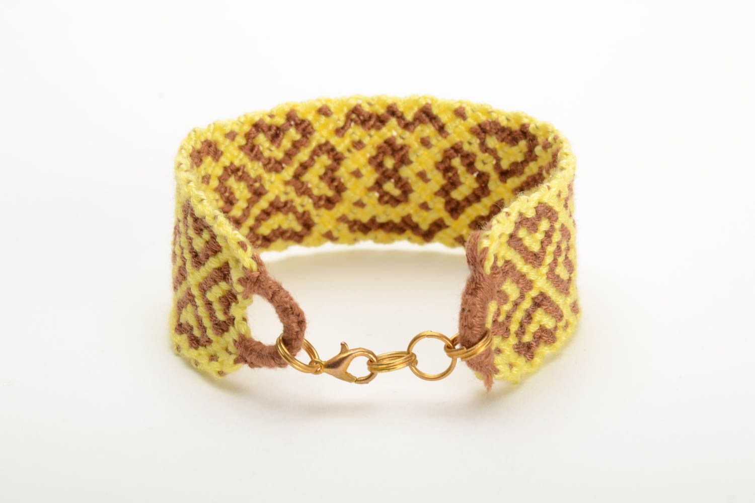 Handmade colored woven wide friendship bracelet made of floss threads yellow with beige photo 3