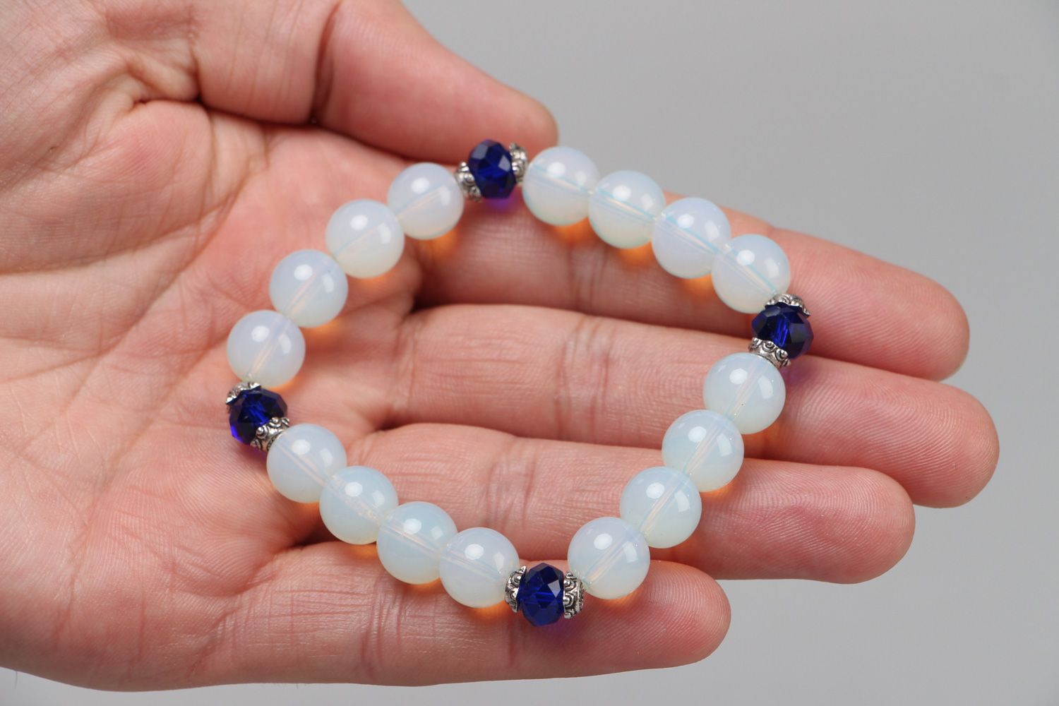 Handmade stretch wrist bracelet with moon stone and blue glass beads for women photo 3