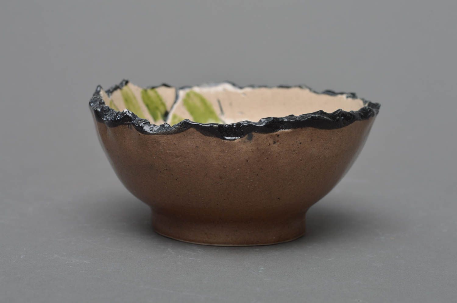 Handmade small light porcelain glazed bowl with dark ragged edges photo 2
