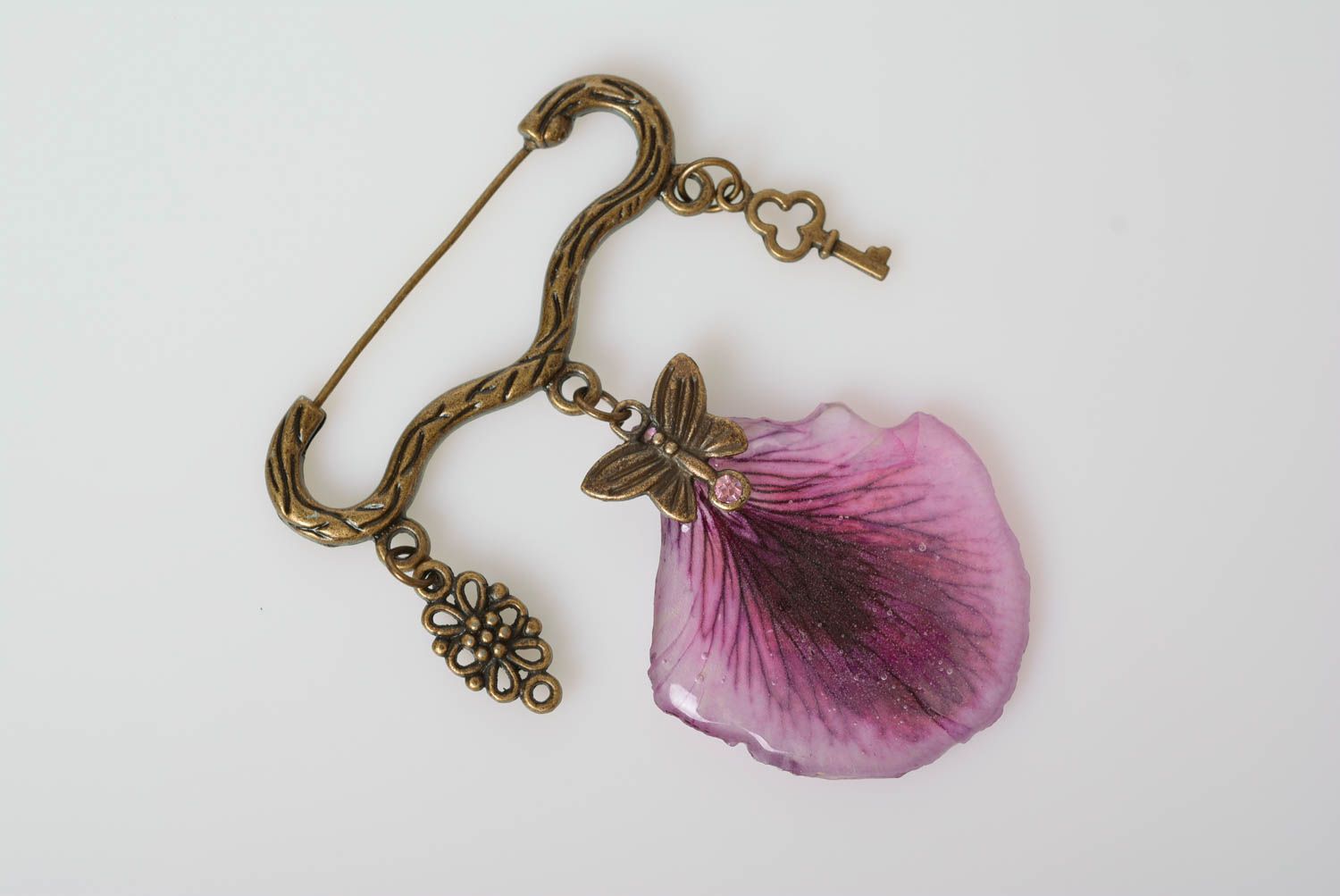 Handmade designer metal figured pin brooch with violet petal in epoxy resin photo 5