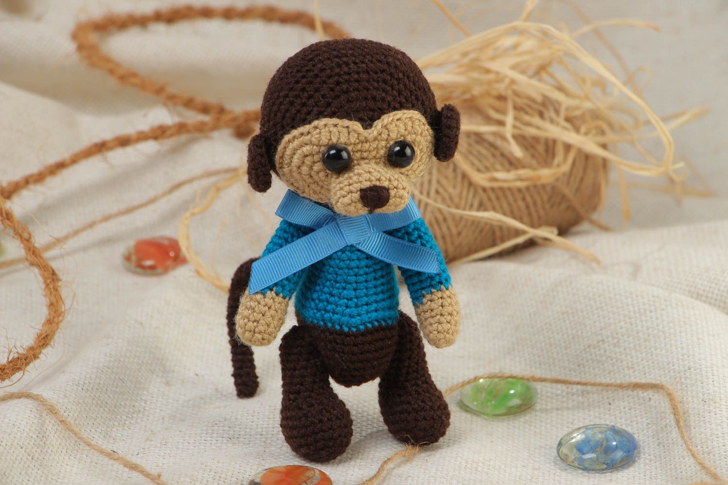 Handmade small crochet soft toy sad monkey in blue sweater with bow photo 1