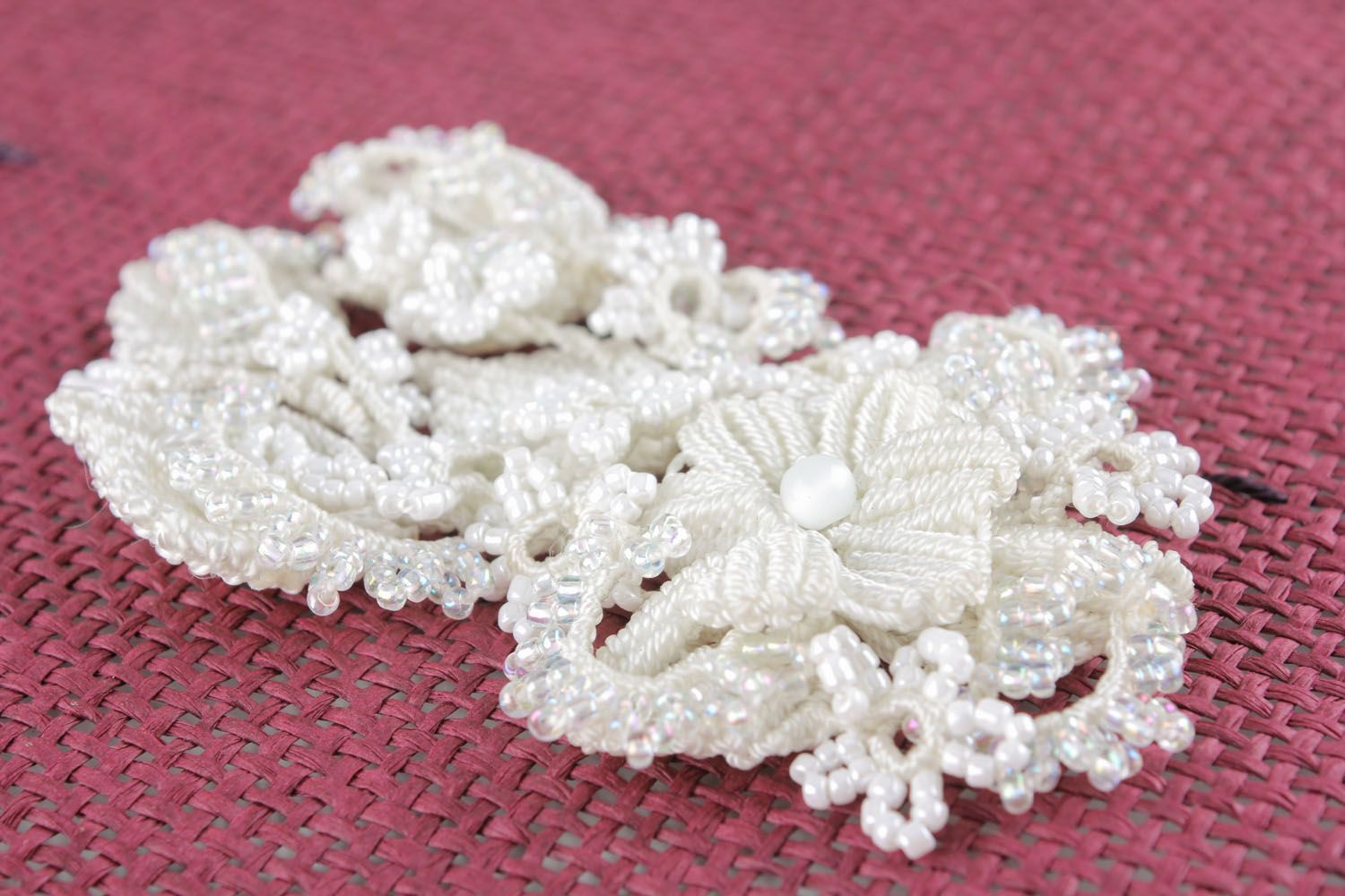 White brooch made of threads and beads photo 3