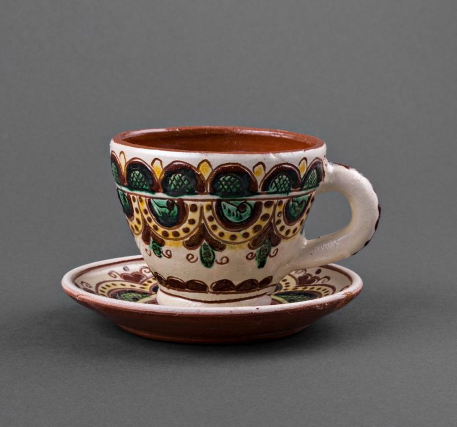 Decorative ceramic coffee cup with a saucer and handle photo 2