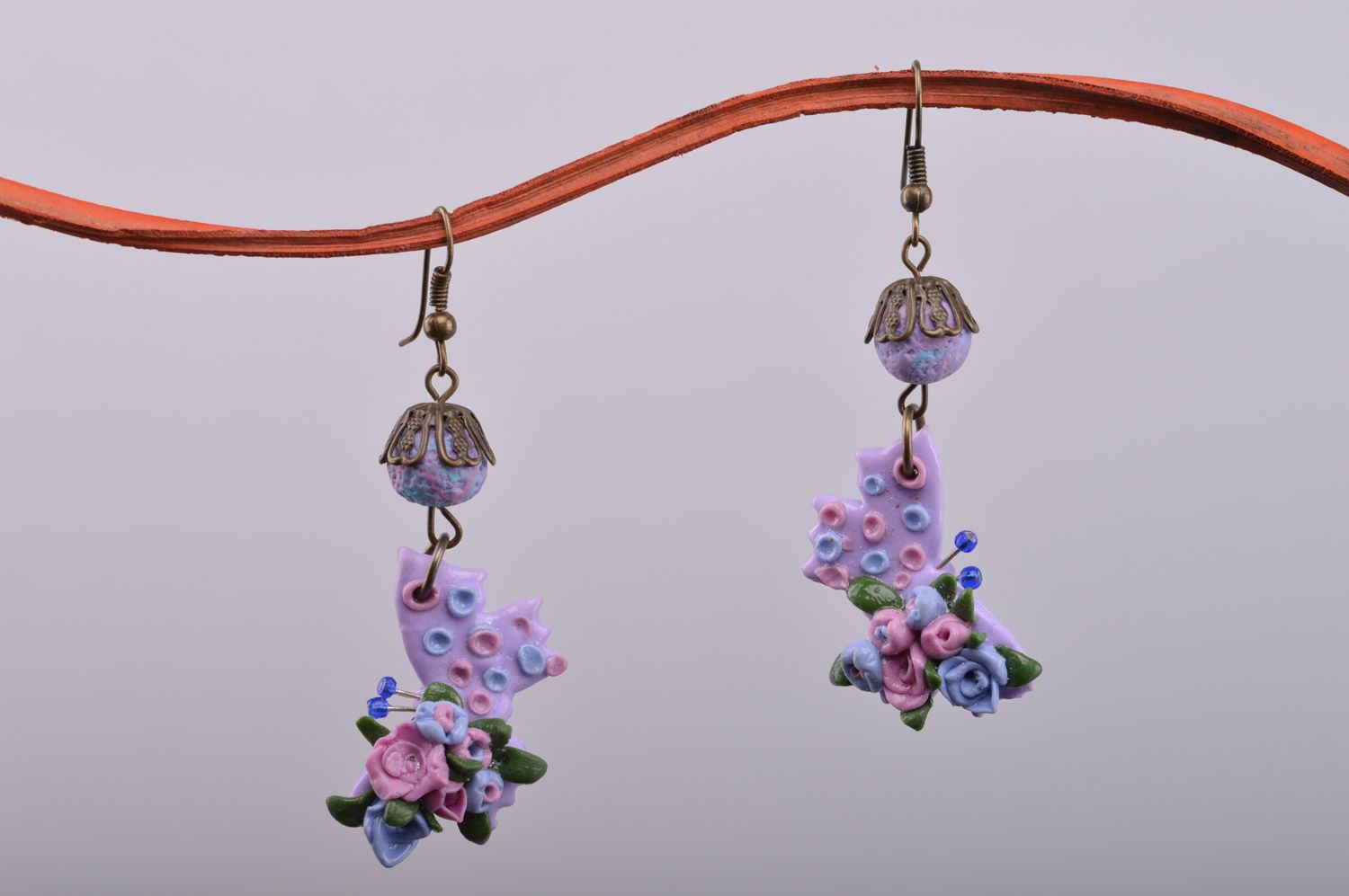 Gentle handmade women's polymer clay bow earrings with flowers of lilac color photo 2