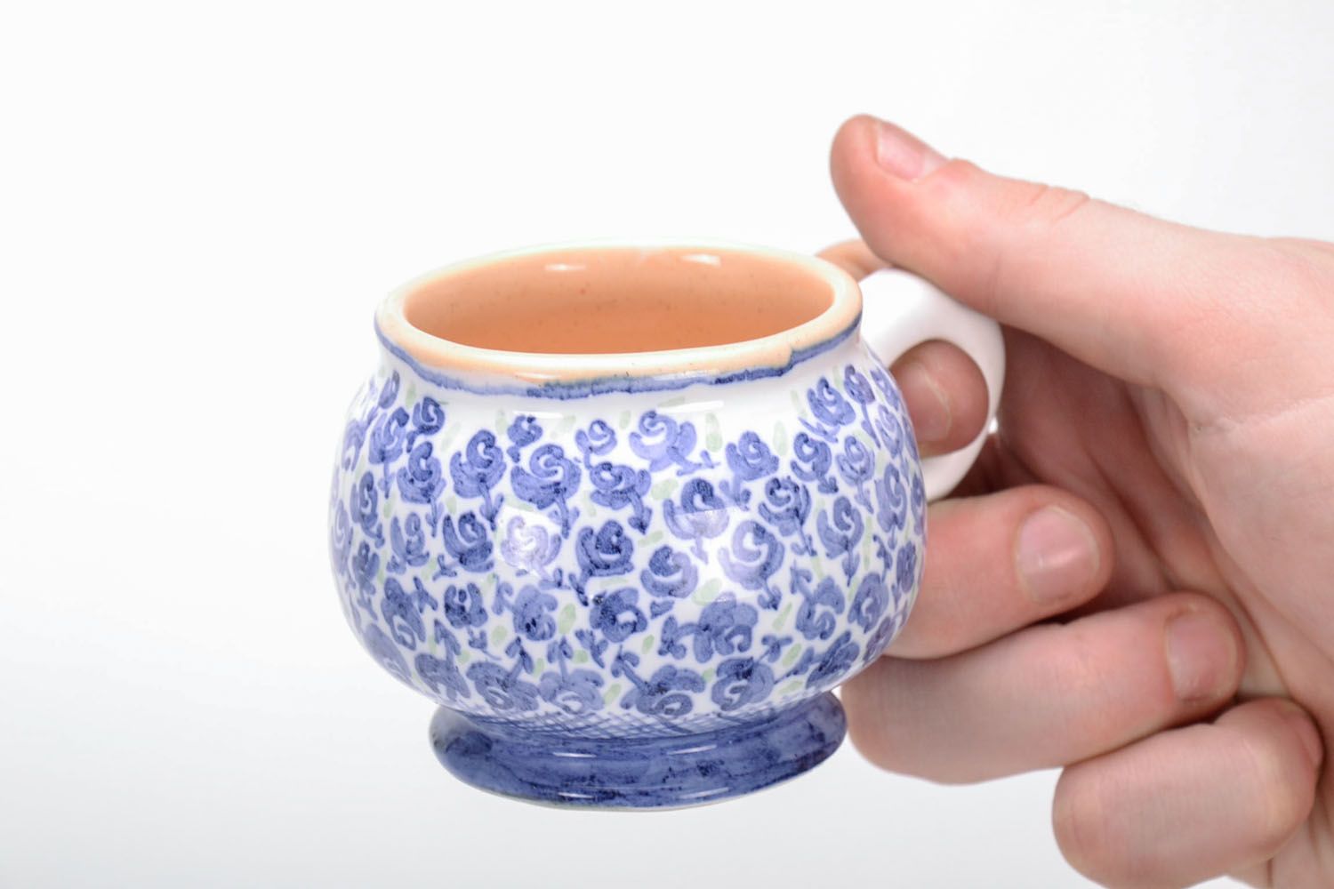 Handmade clay glazed drinking cup in white and blue color with violets' pattern photo 5