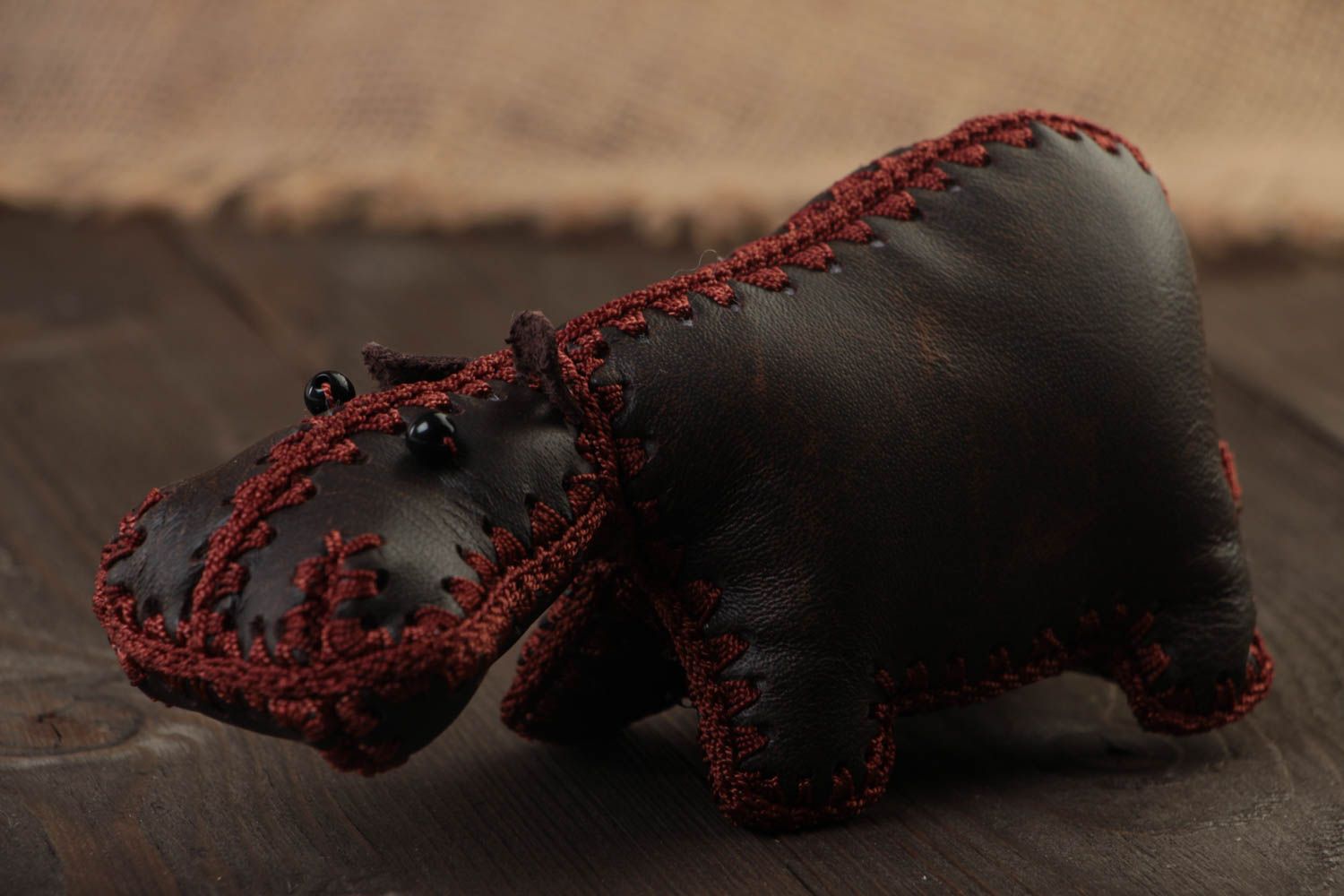 Handmade designer soft toy hippo sewn of genuine dark brown leather for interior photo 1