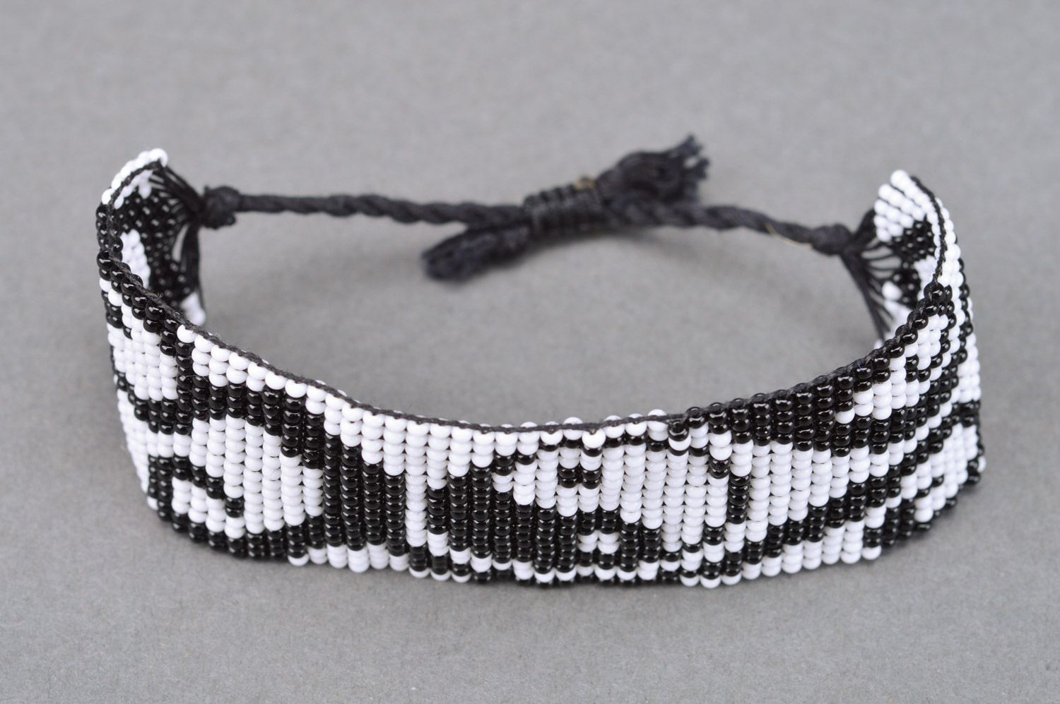 Handmade beaded wide bracelet with ties and black and white pattern photo 5