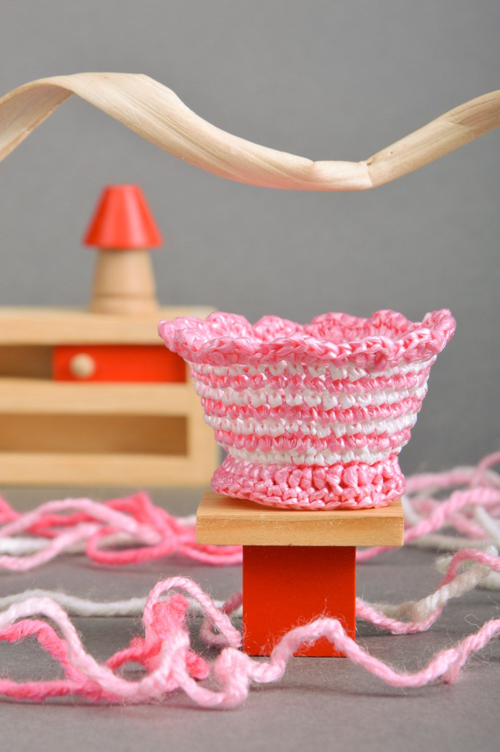 Handmade Easter egg stand crocheted of plastic threads in pink and white colors photo 1