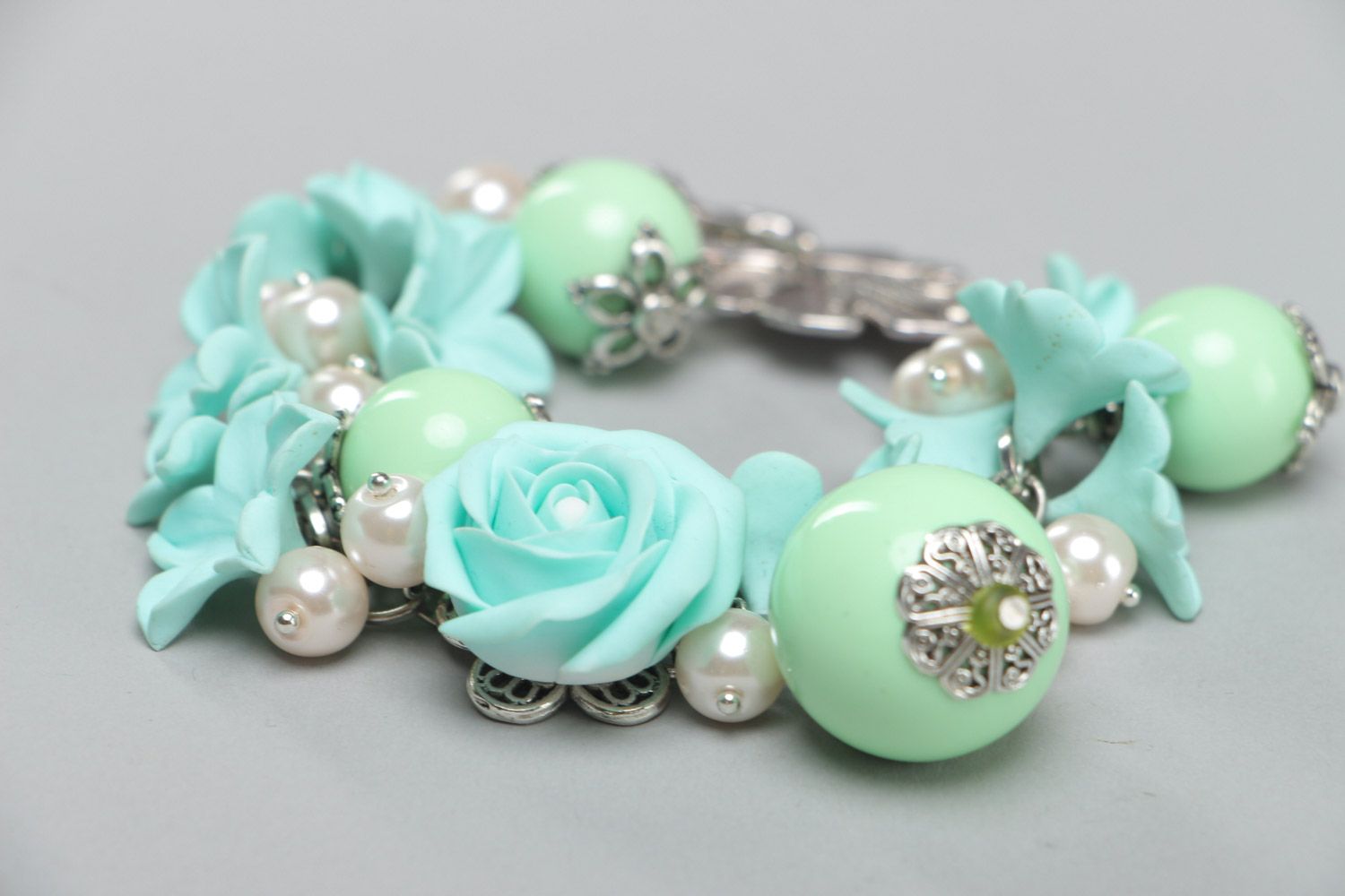 Handmade beautiful designer flower bracelet with charms made of polymer clay in mint color photo 4