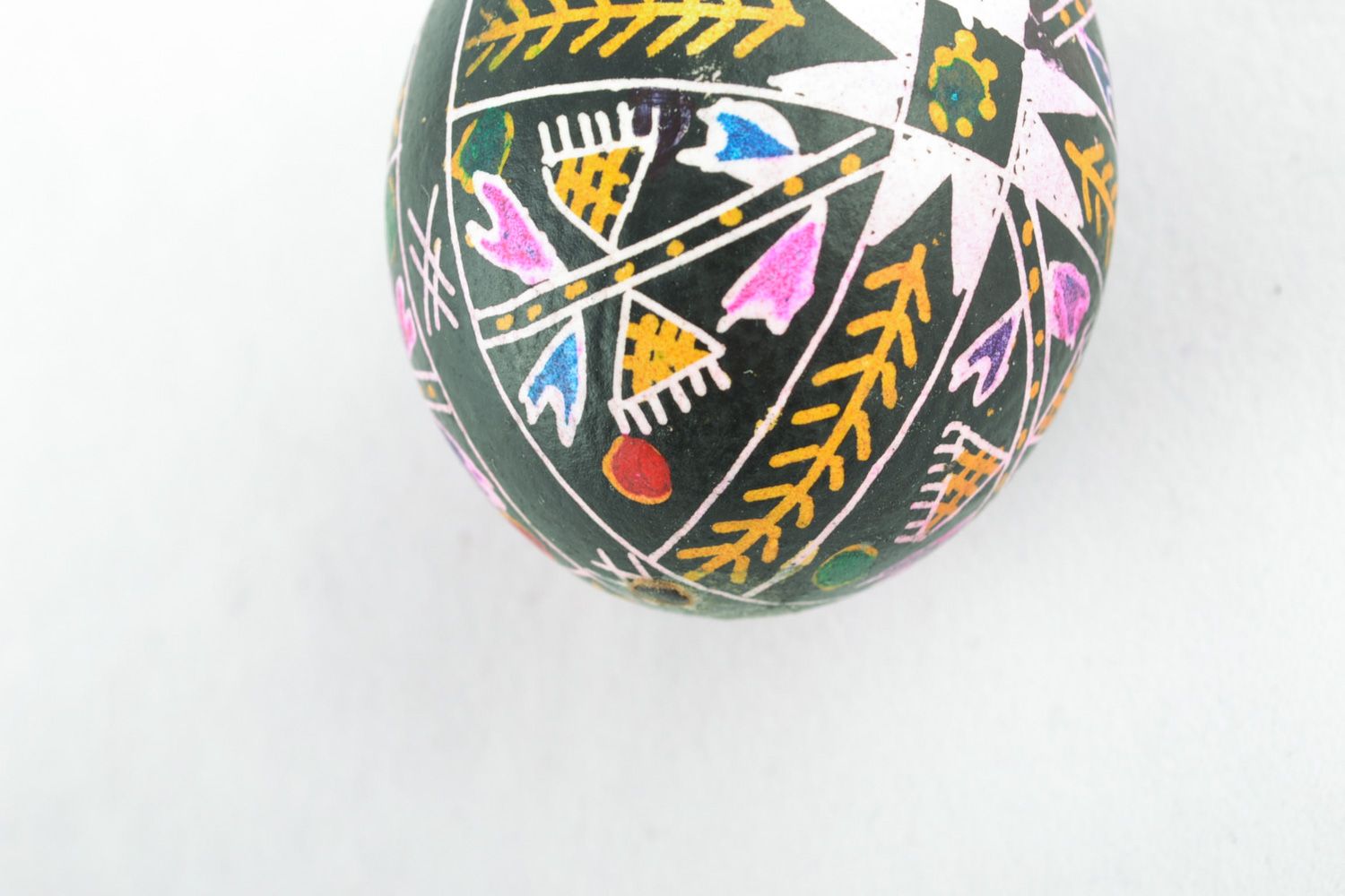 Handmade black Easter egg with rich pattern painted with wax and aniline dyes photo 4
