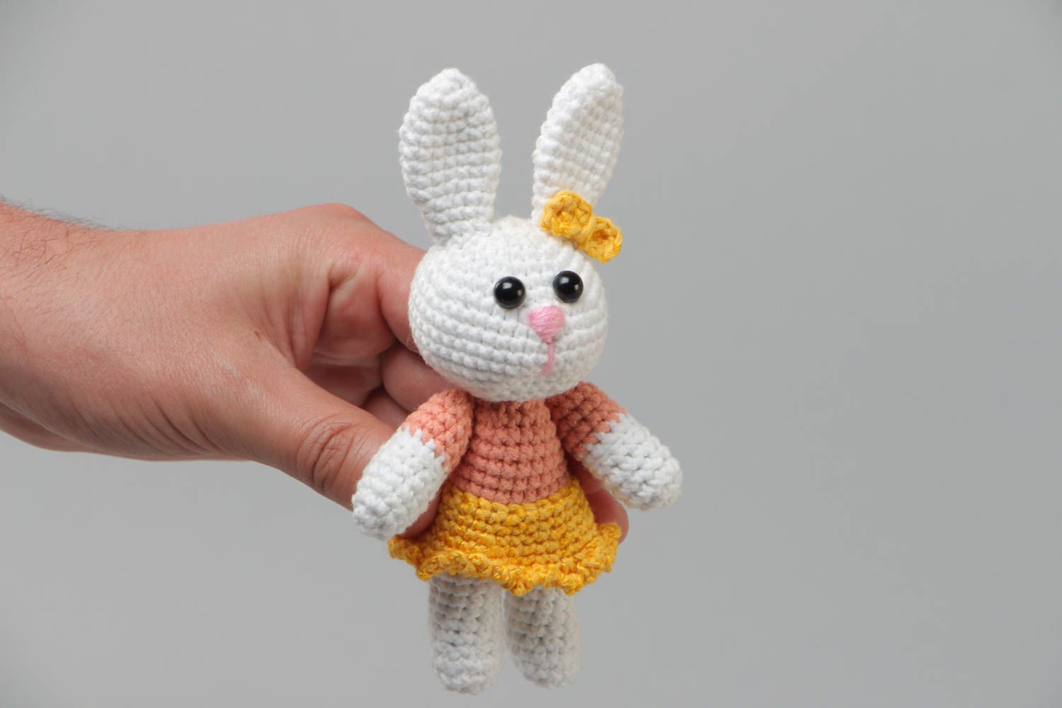 Handmade soft knitted white girl-rabbit toy in a dress for children photo 5