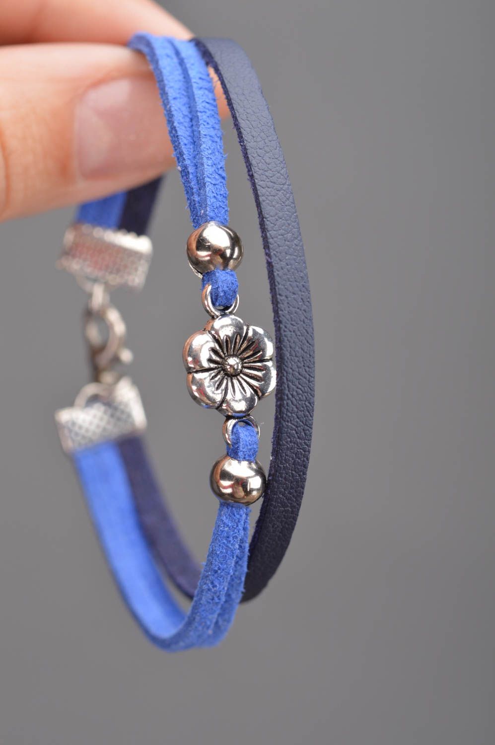 Handmade thin blue genuine leather cord wrist bracelet with metal flower element photo 2
