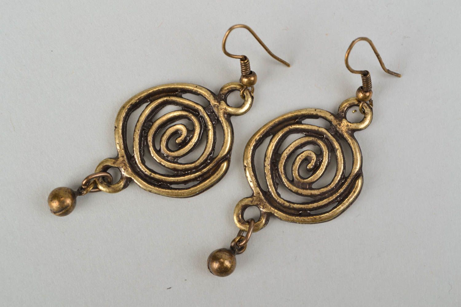 Cast metal earrings of unusual shape photo 3