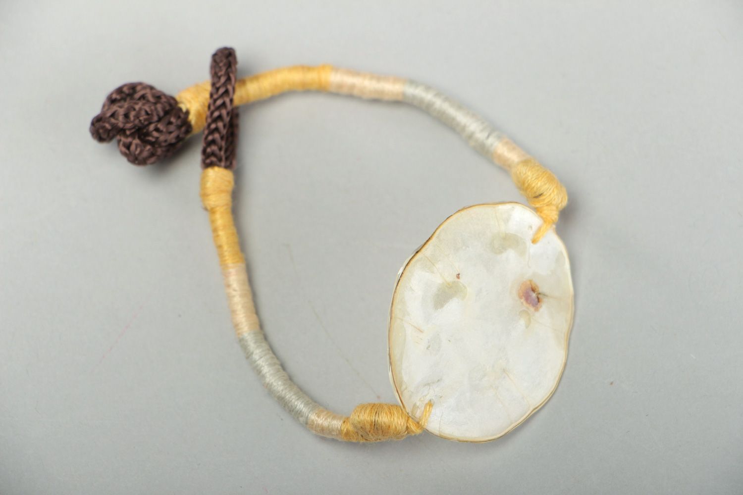 Handmade friendship bracelet with dried flowers coated with epoxy Lunaria photo 1