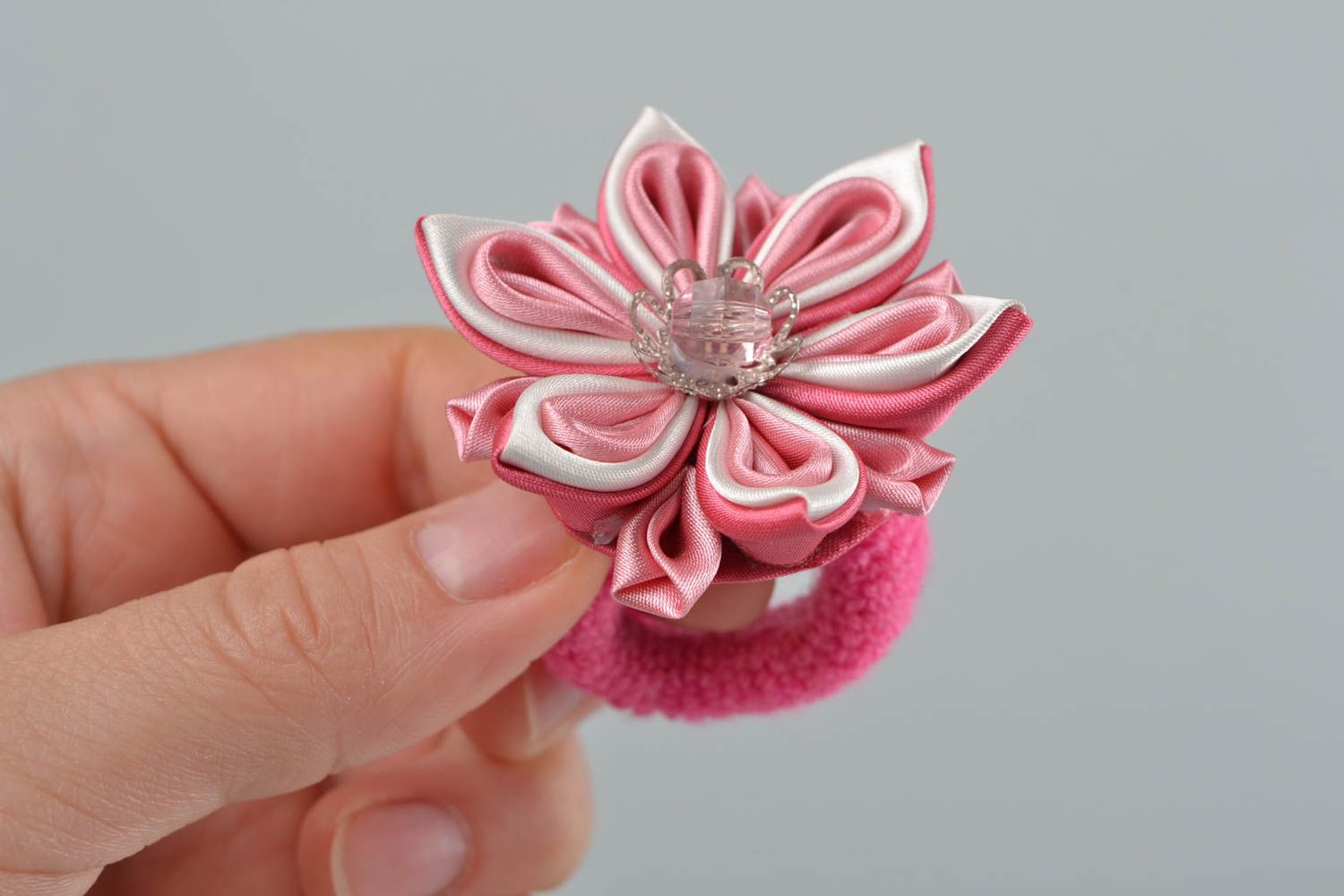 Pink handmade hair tie made of satin ribbons in shape of flower for kids photo 1