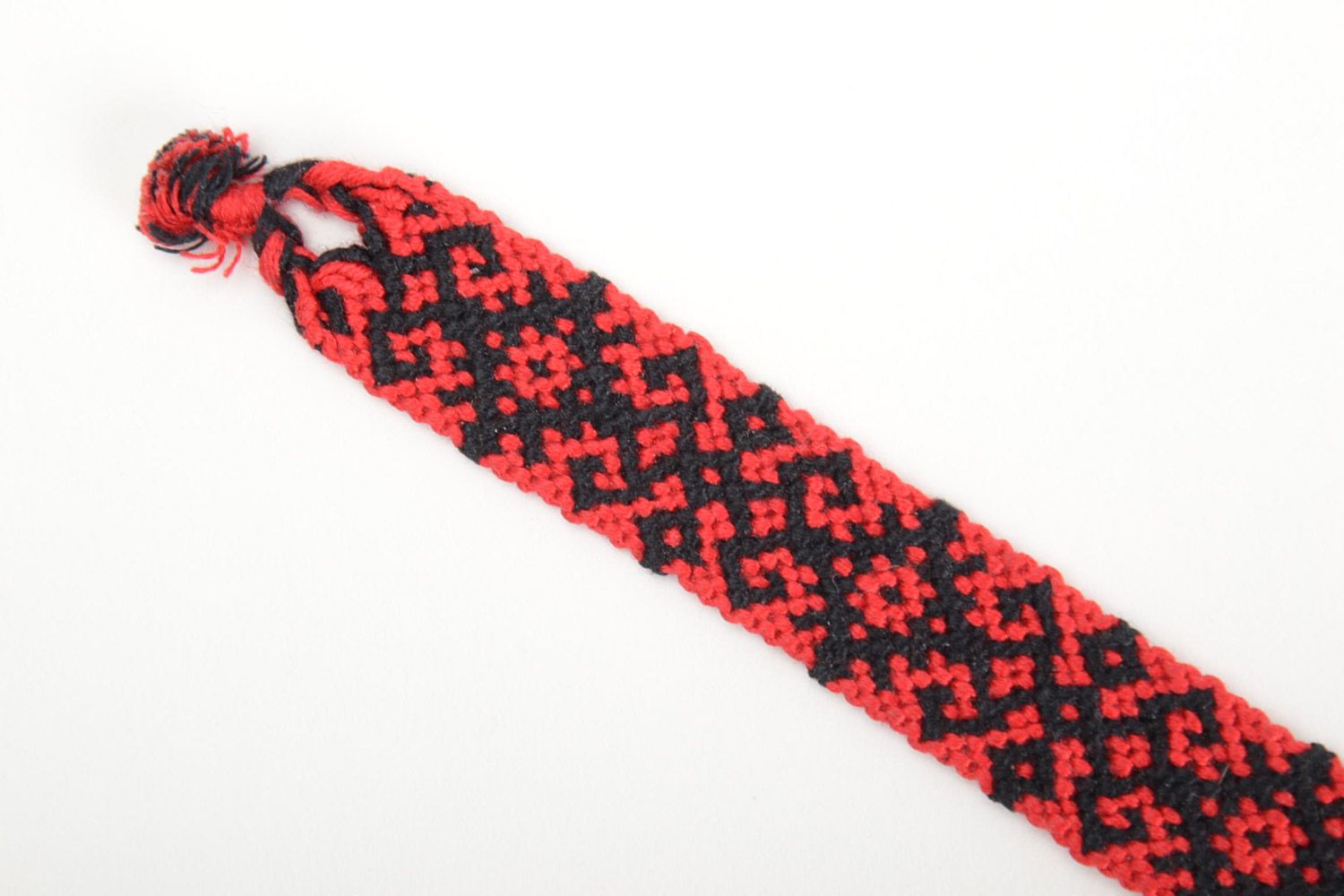 Handmade friendship wrist bracelet woven of threads with red and black ornament photo 4