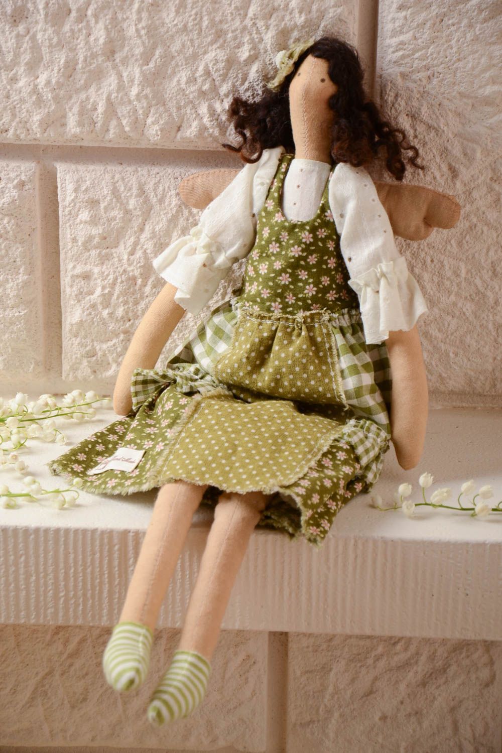 Handmade soft doll sewn of natural fabrics with curly hair in green dress photo 1