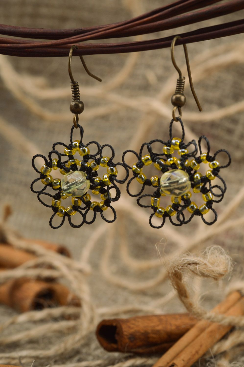Handmade lacy earrings woven of satin threads and beads black and yellow photo 1