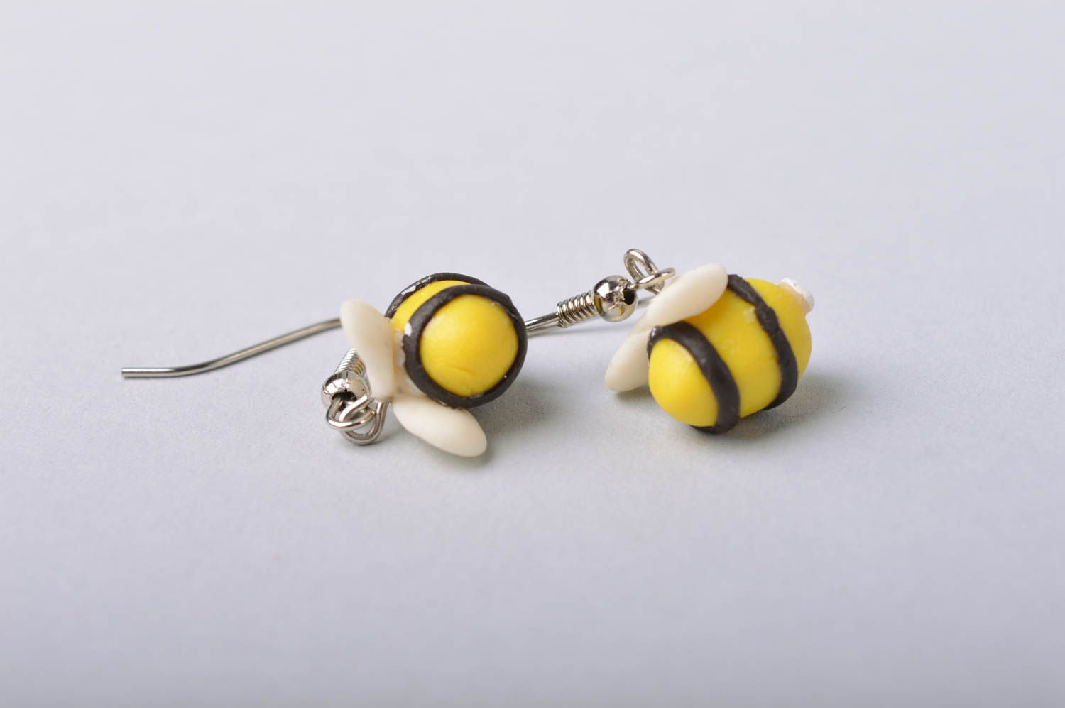Handmade funny small dangle earrings with cold porcelain yellow bees photo 2