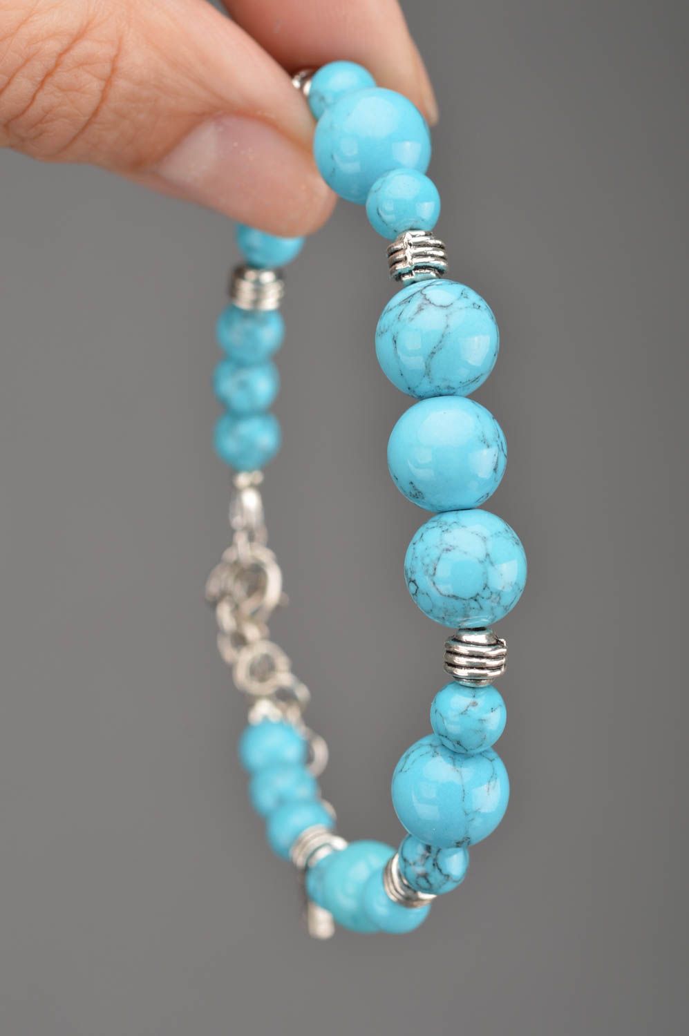 Blue handmade bracelet made of beads of turquoise color with separators photo 2