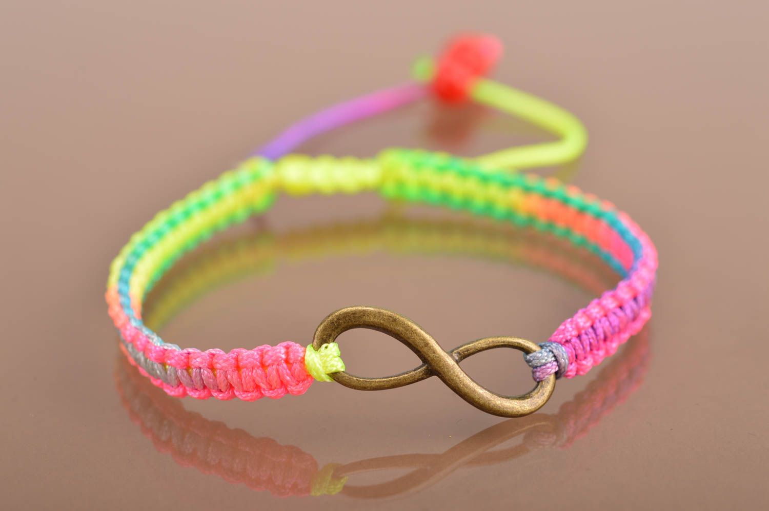Handmade cute thin colorful woven wrist bracelet made of silk with insert photo 2
