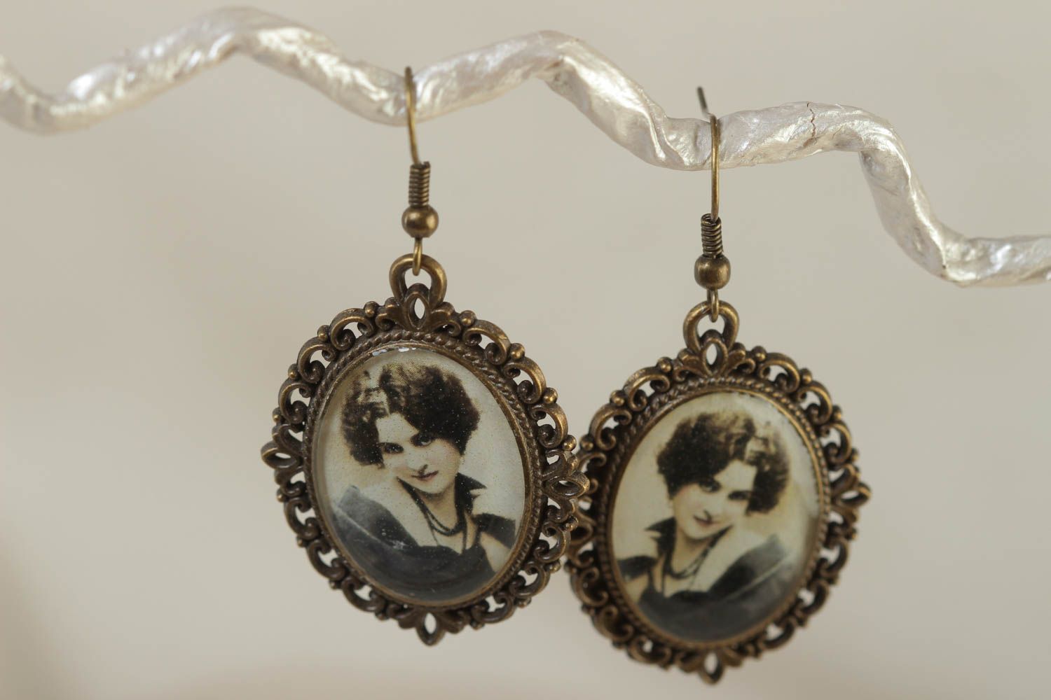 Egg-shaped vintage handmade earrings made of glass glaze with a portrait of a woman photo 1