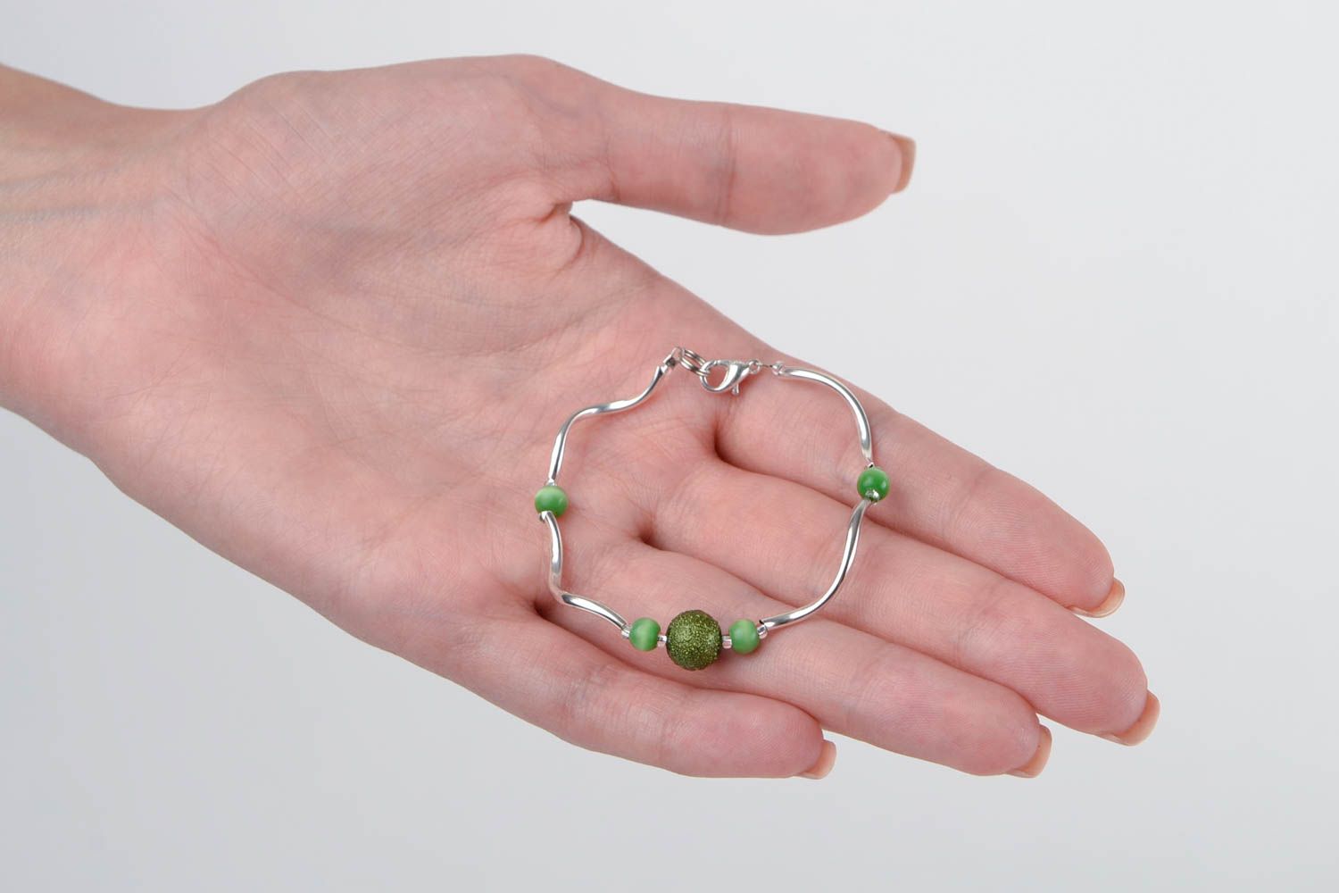 Unique elegant metal bracelet with green beads for a young girl photo 2