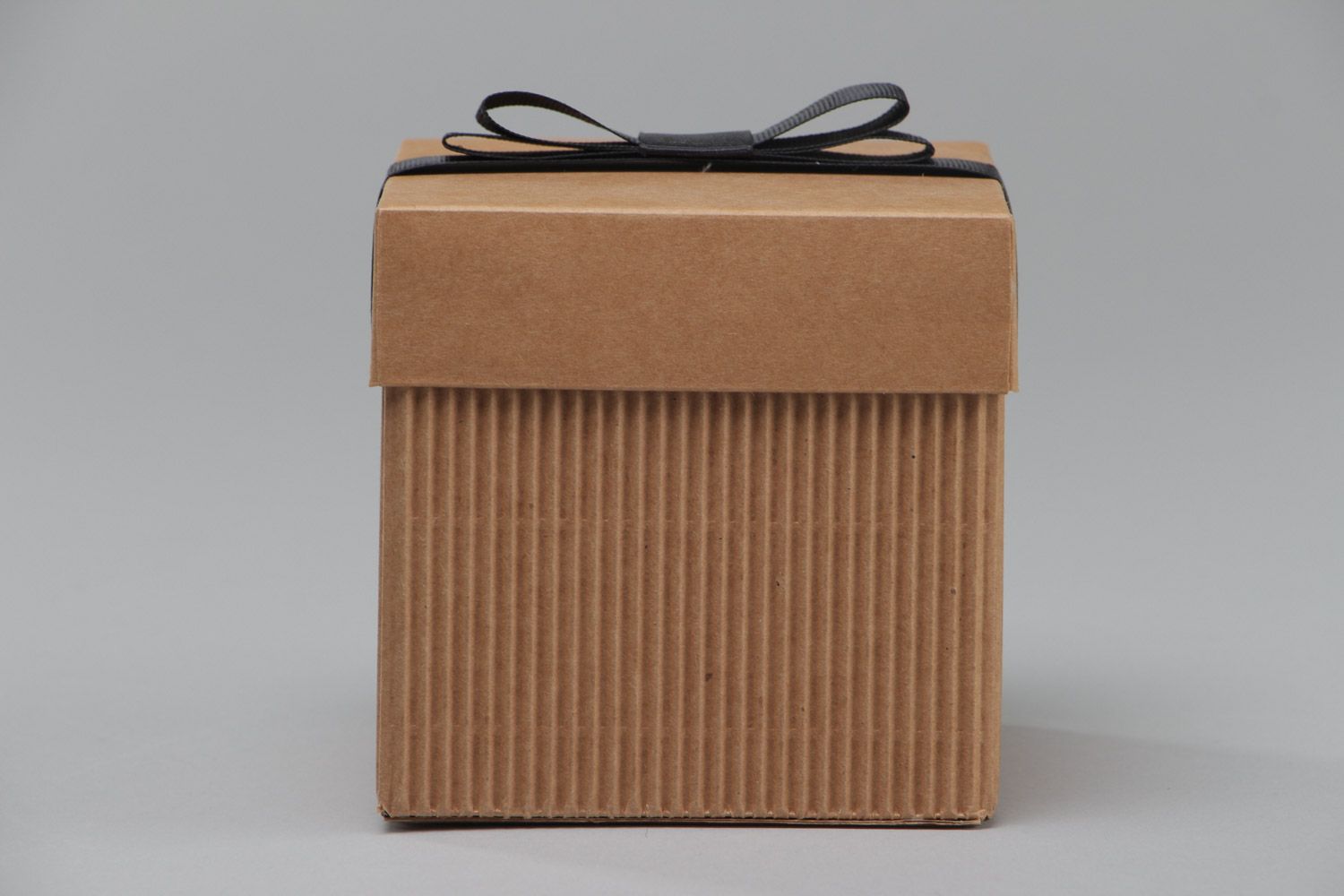 Handmade stylish corrugated carton gift box with black rep ribbon bow on lid photo 2