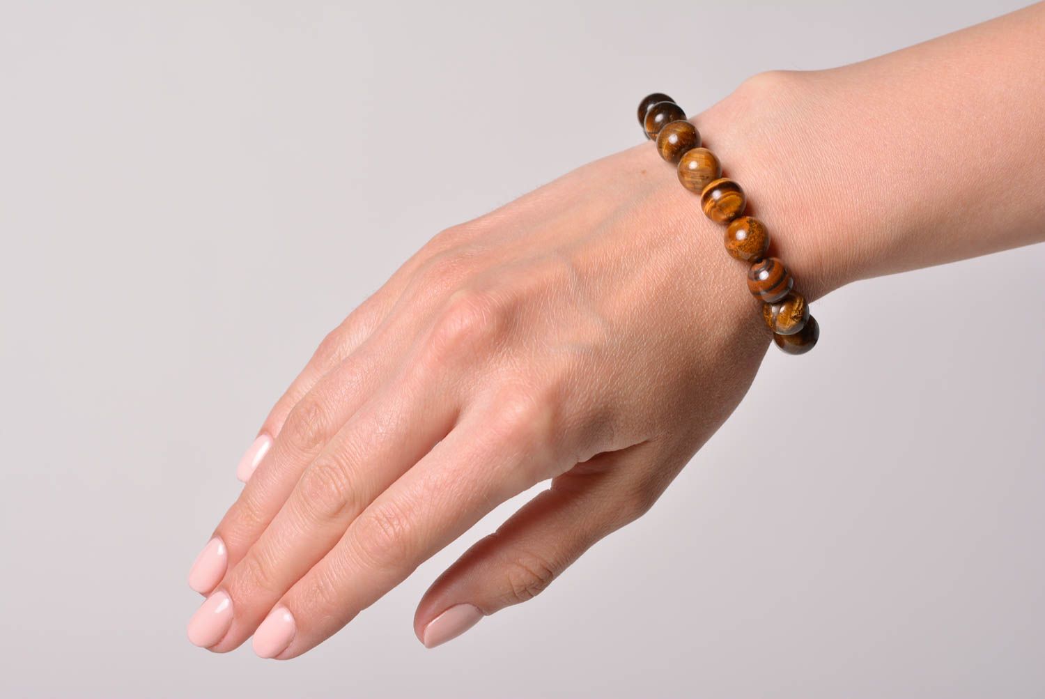 Handmade wrist bracelet with tiger's eye stone beads threads on fishing line photo 1