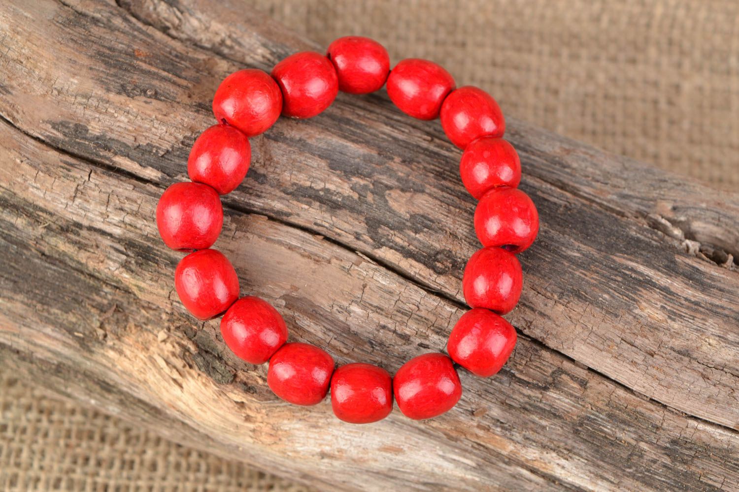 Red wooden bracelet with elastic band photo 2