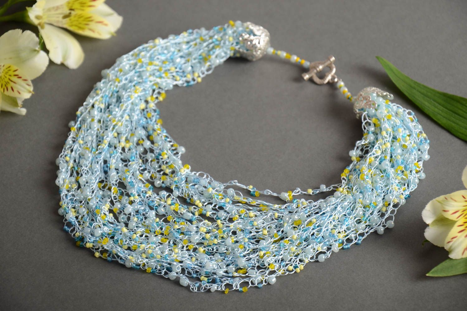 Handmade multi row airy necklace crocheted of beads in light blue color shades photo 1