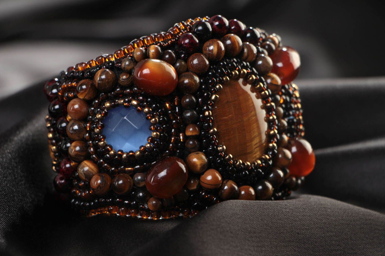 Beautiful handmade women's beaded bracelet with natural stones on leather basis photo 1