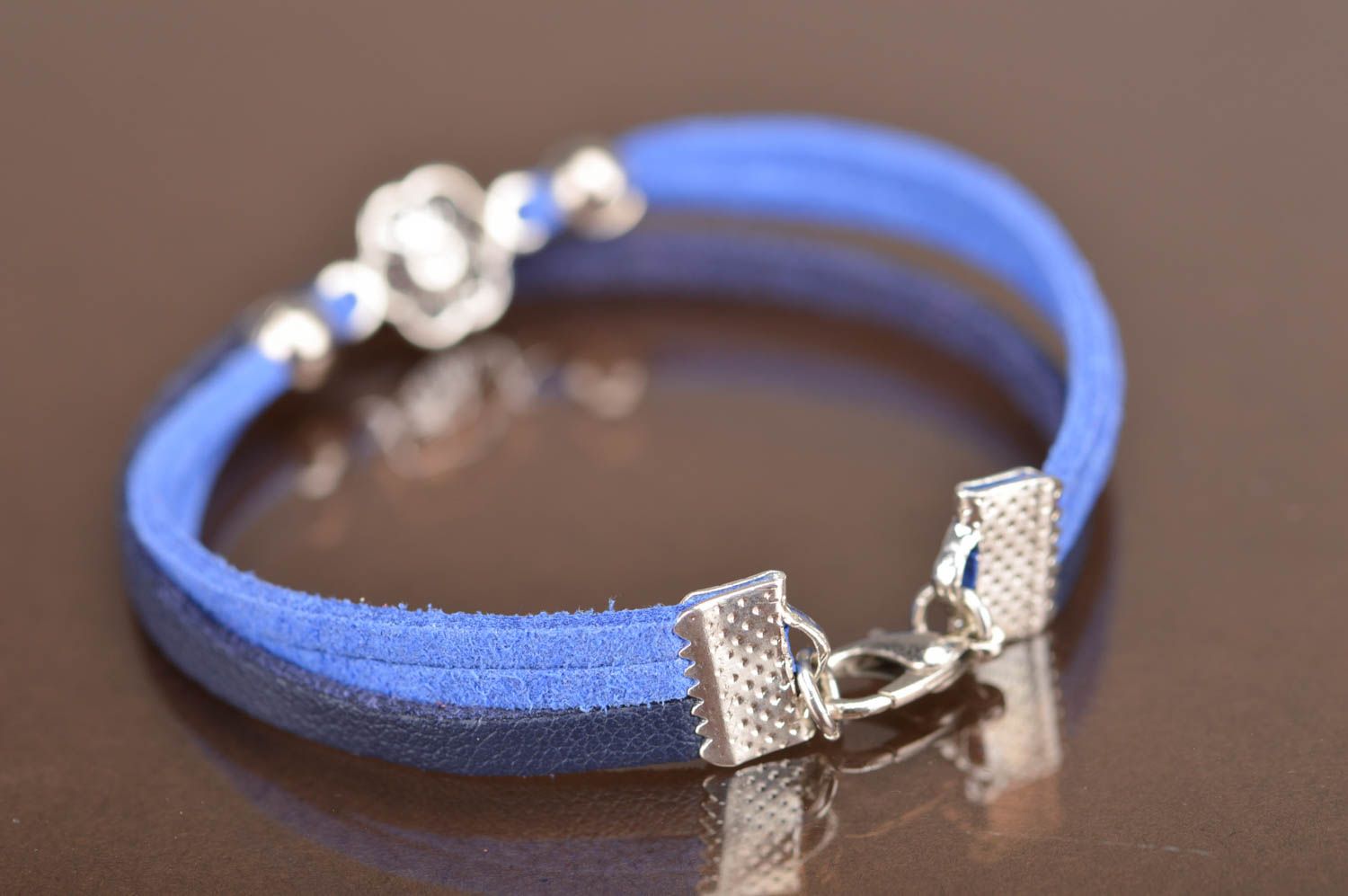 Handmade thin blue genuine leather cord wrist bracelet with metal flower element photo 3
