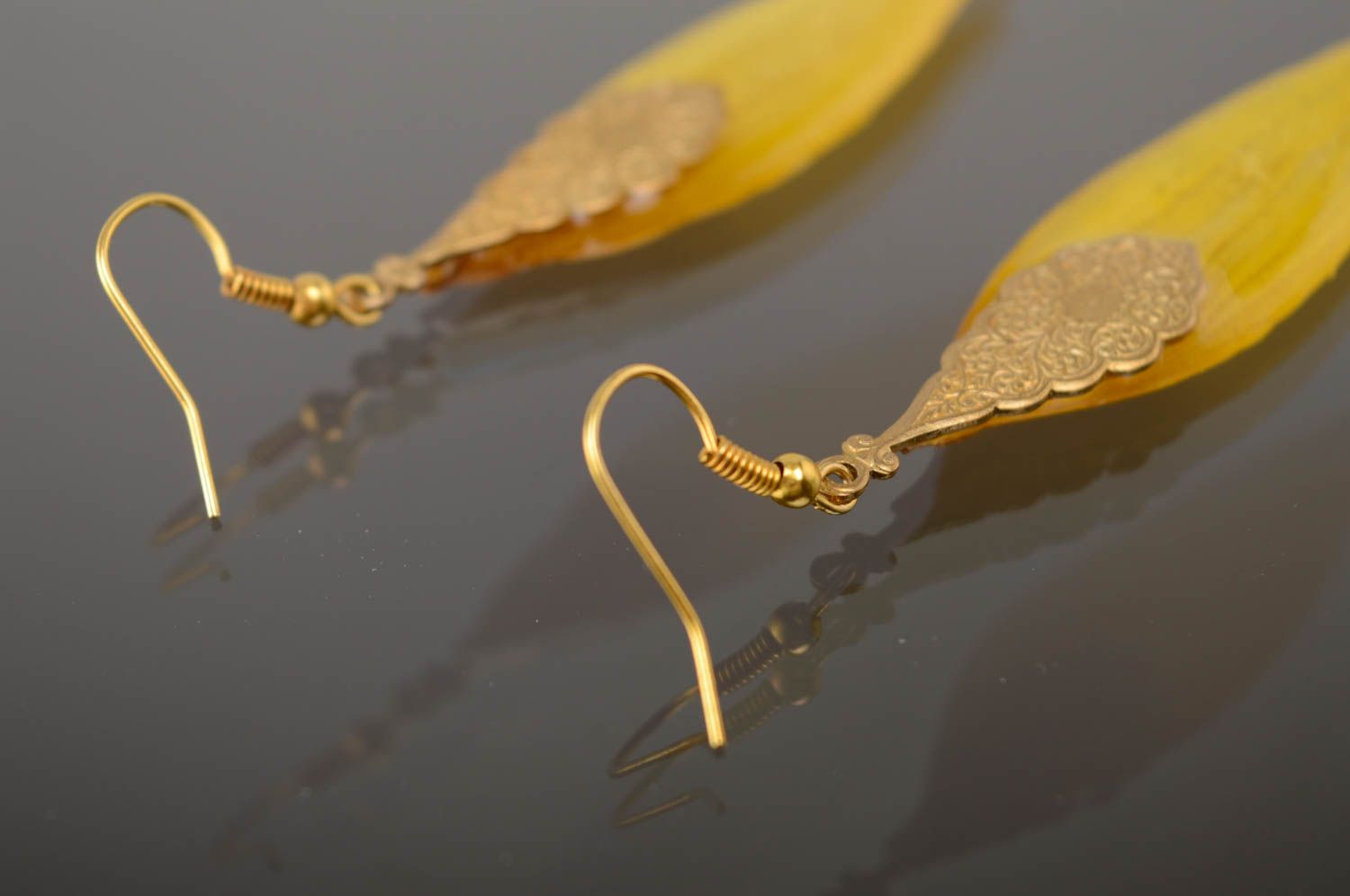 Epoxy long earrings with natural sunflower petals photo 4