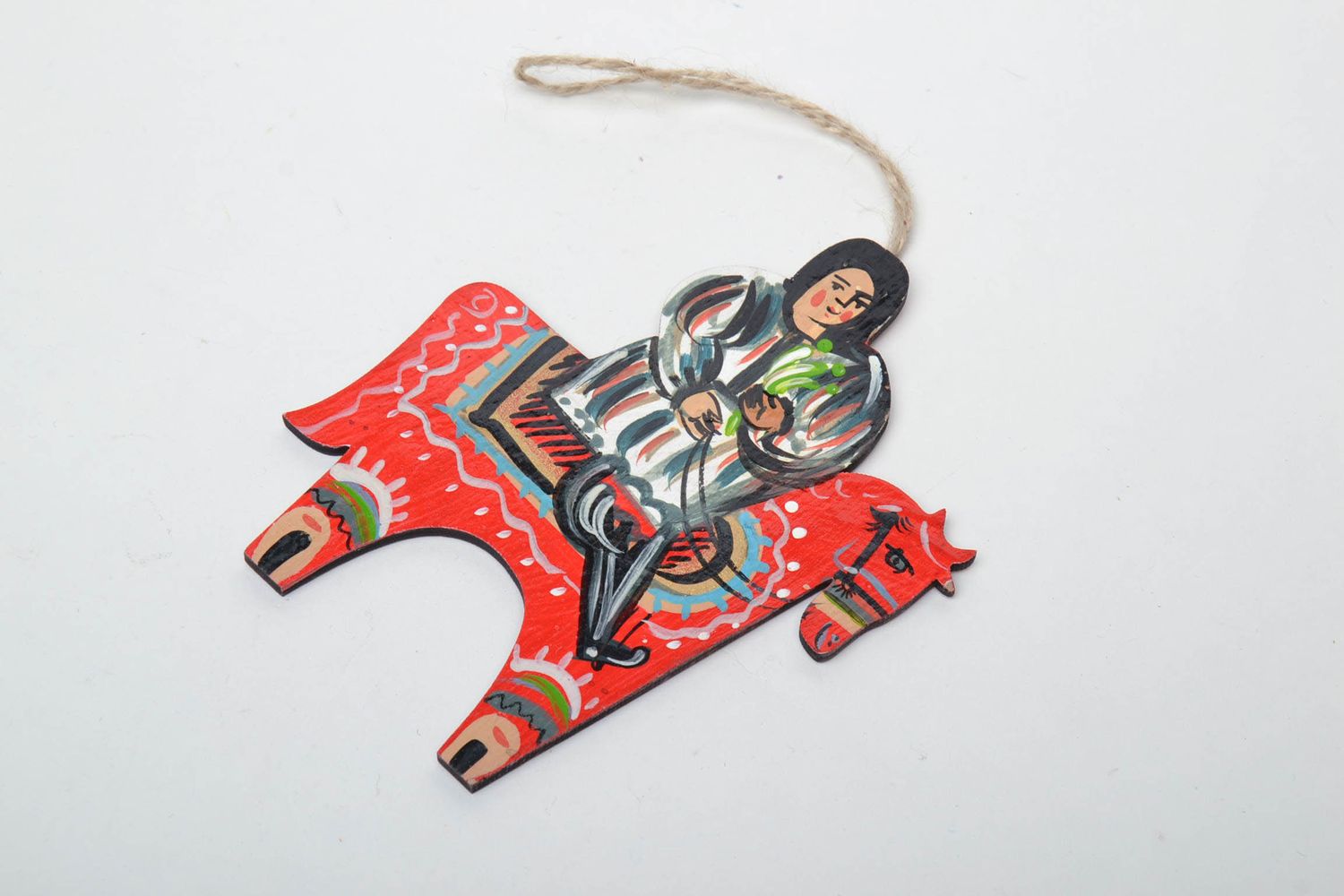Wooden interior pendant in the shape of a guy riding a horse photo 3