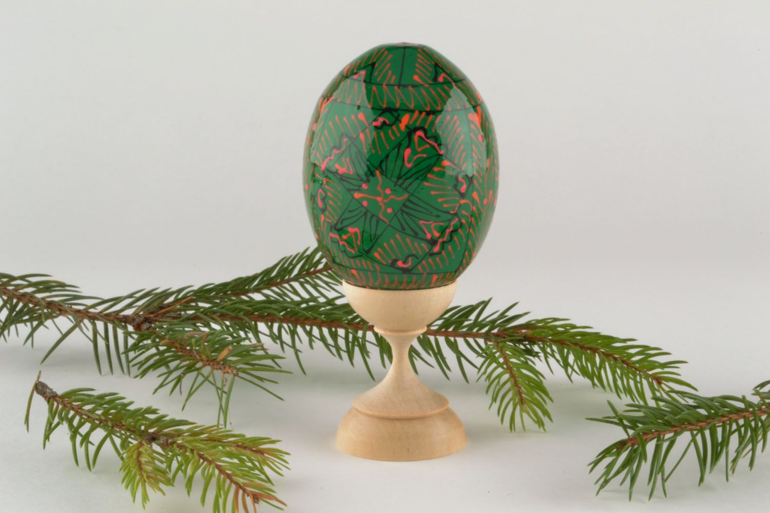 Wooden egg with ornaments photo 1