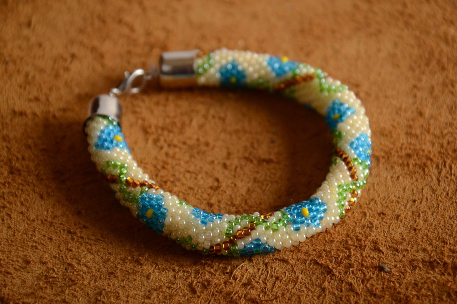 Bright beaded cord adjustable bracelet in ethnic style with floral ornament photo 1