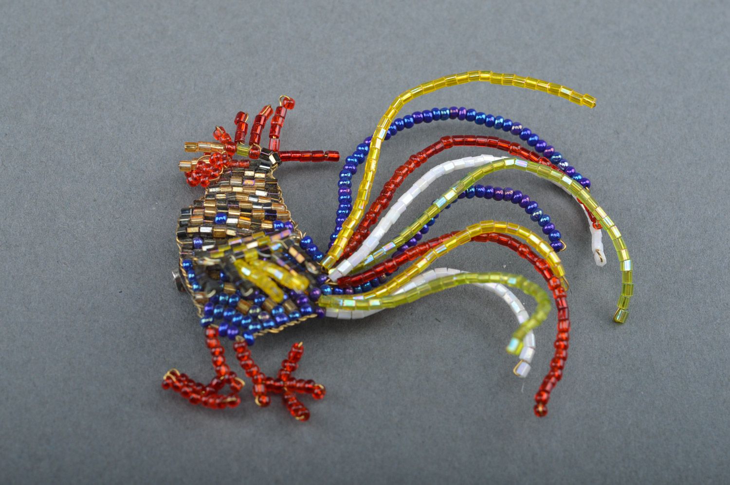 Unusual multi-colored beaded brooch hand woven with fishing line in the shape of cock photo 2