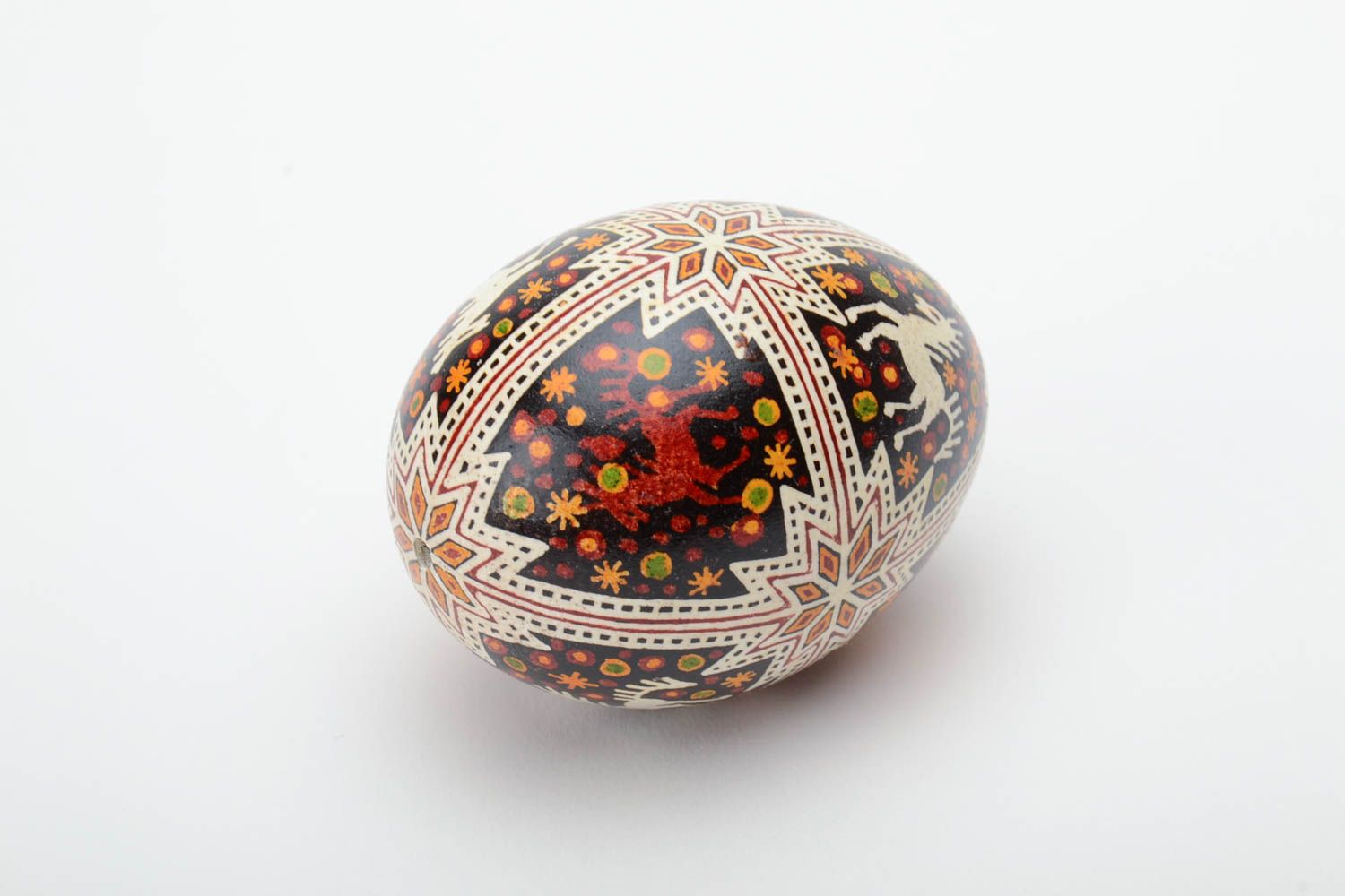 Festive handmade painted Easter egg with special symbol waxing technique photo 4