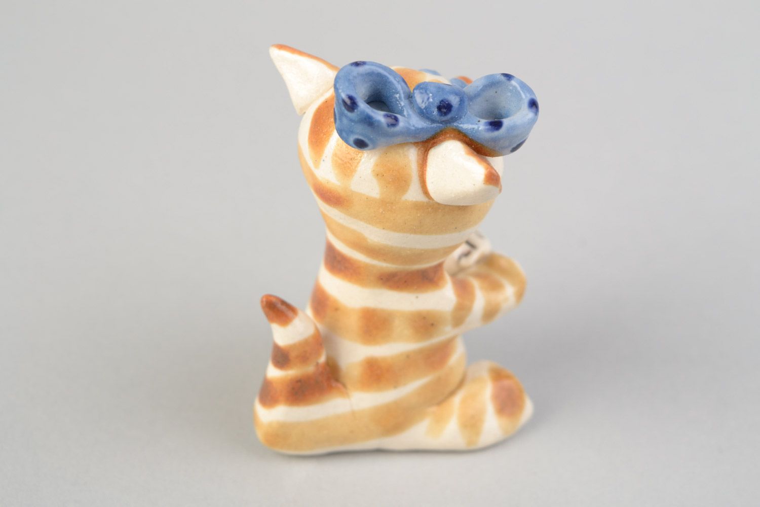 Handmade decorative miniature glazed ceramic figurine of kitten with blue bow photo 4