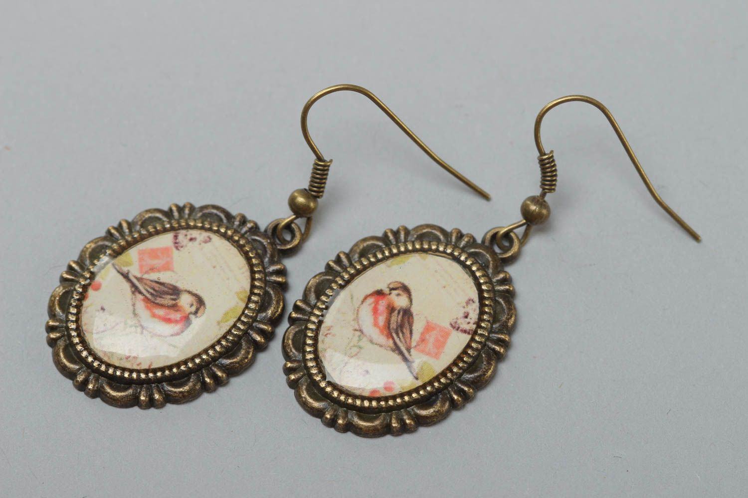 Handcrafted vintage oval earrings made of glass glaze with bullfinch prints on them photo 2