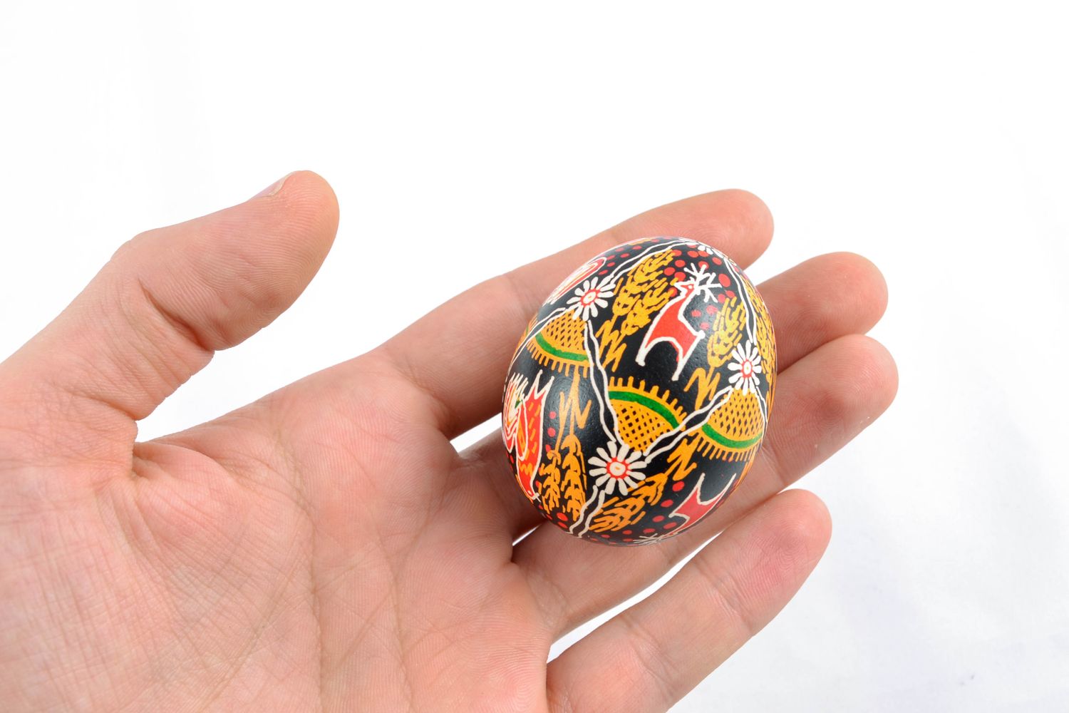 Handmade Easter egg with bright painting in Ukrainian style photo 2