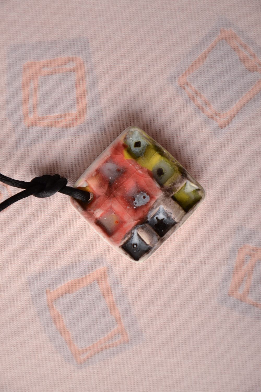 Painted clay pendant with cord photo 1