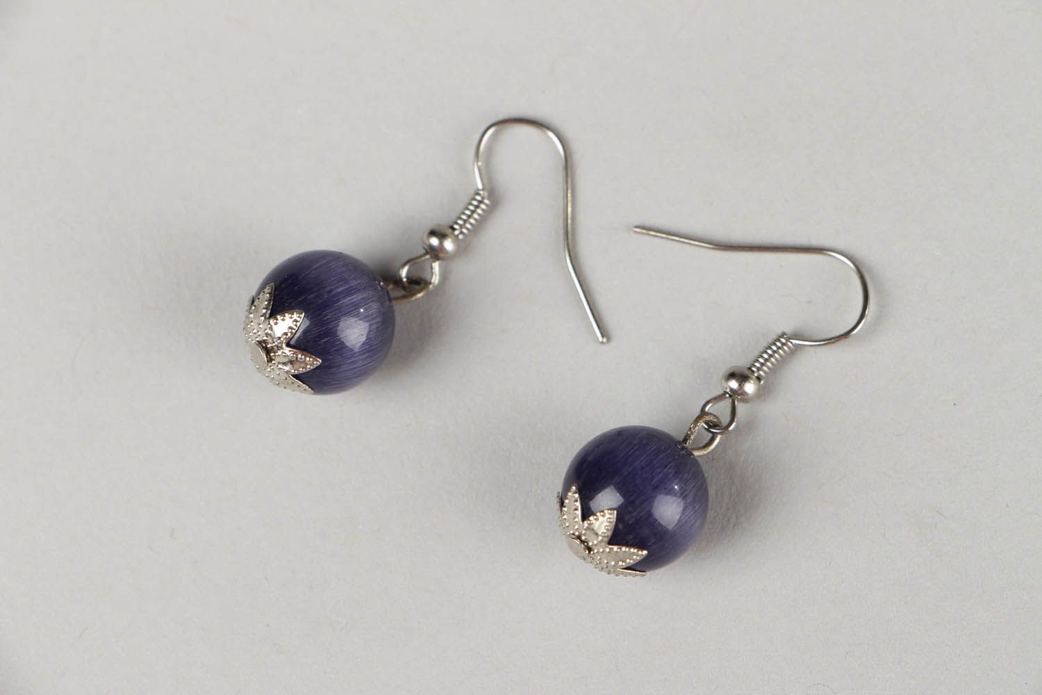 Earrings with natural cat's eye stone photo 1