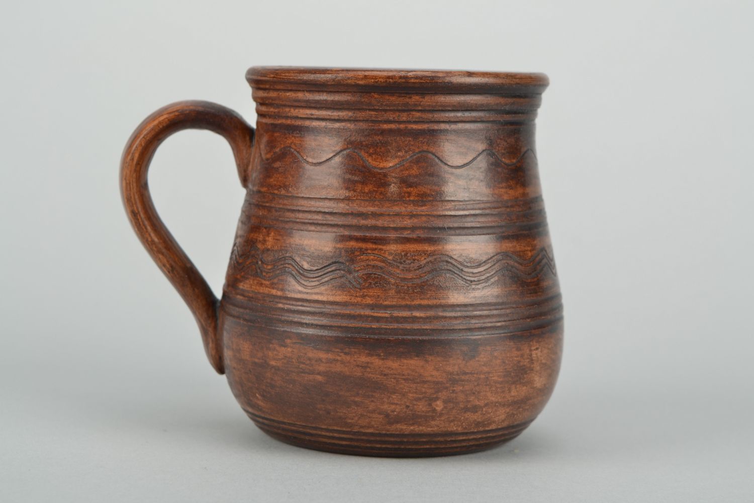 11 oz clay glazed coffee cup in rustic design with handle and no pattern photo 1
