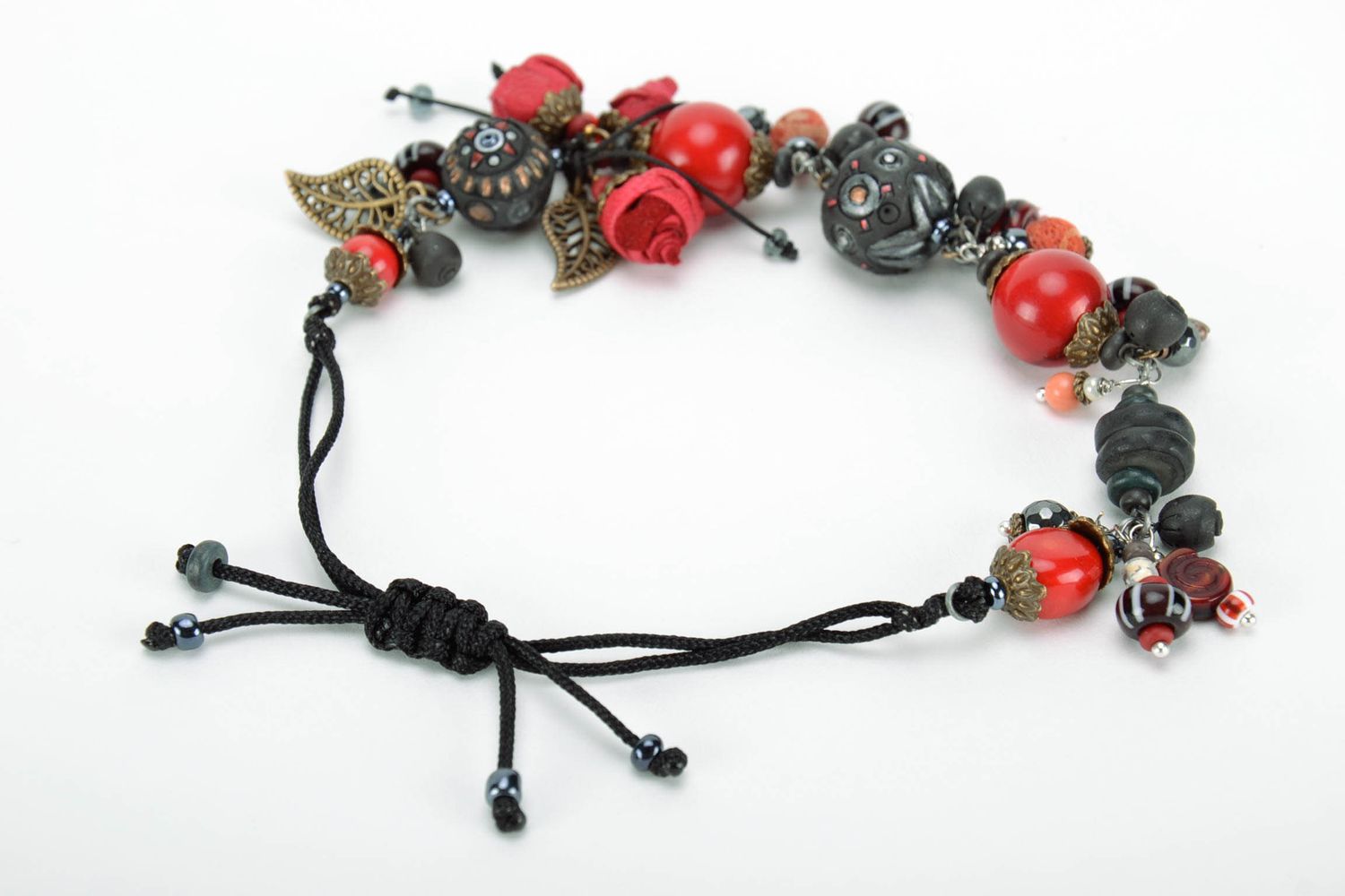 Bracelet made of black smoked ceramics with pendants  photo 3