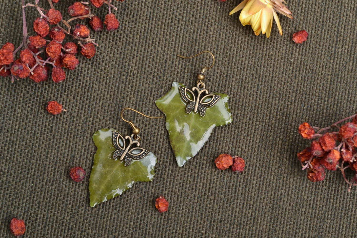 Dangle earrings with dried ivy leaves coated with epoxy resin photo 1
