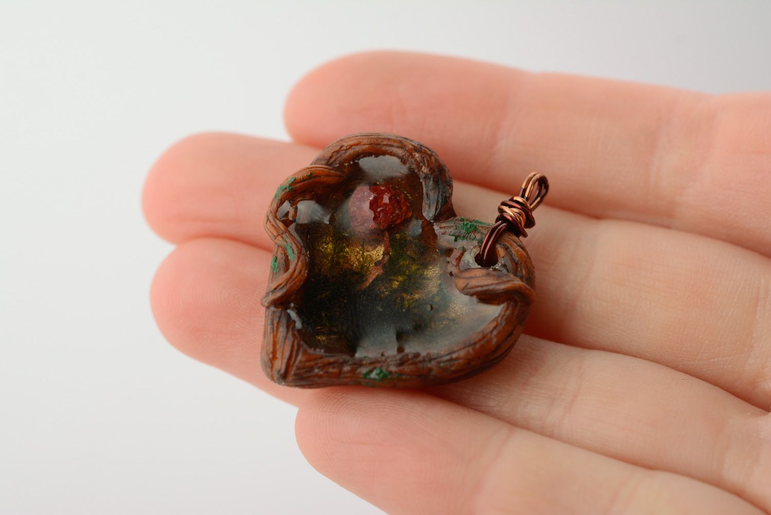 Homemade heart-shaped pendant with moss and berries inside coated with epoxy photo 4