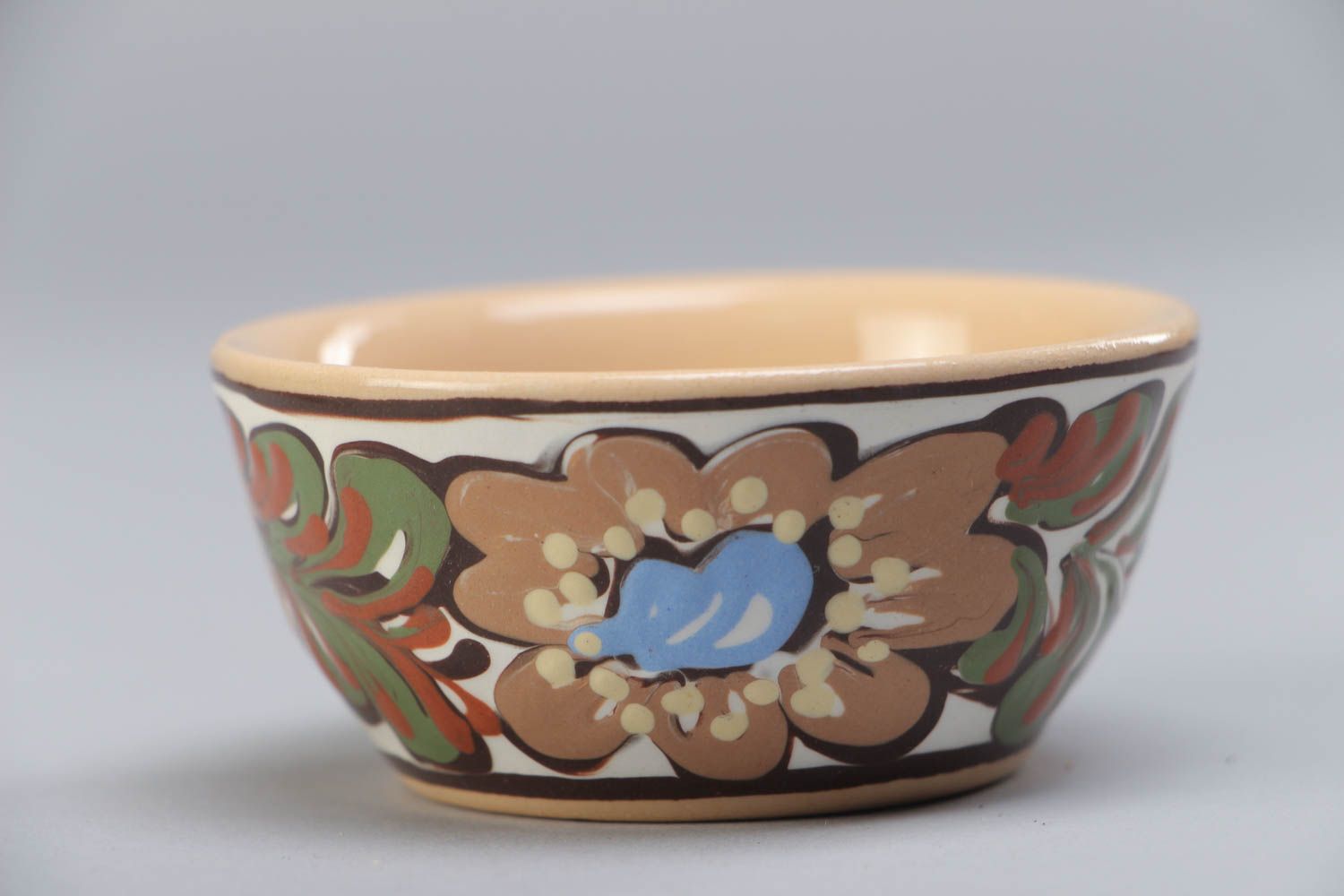 Handmade decorative small ceramic bowl ornamented with colorful glaze for sauces photo 2