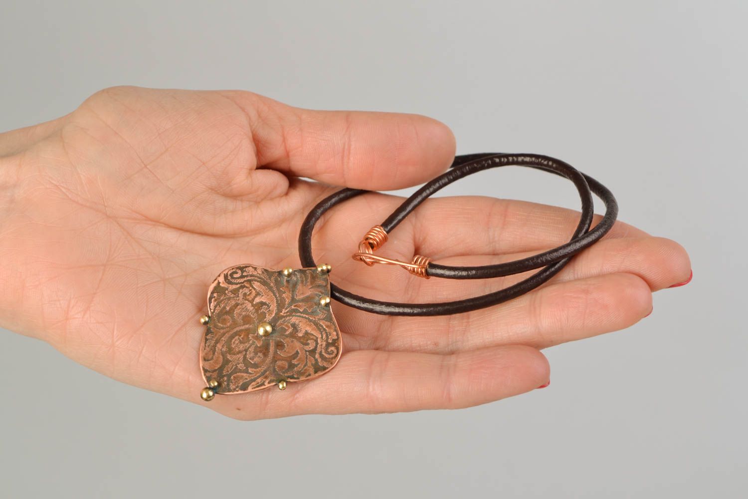 Latten and copper pendant on cord photo 2